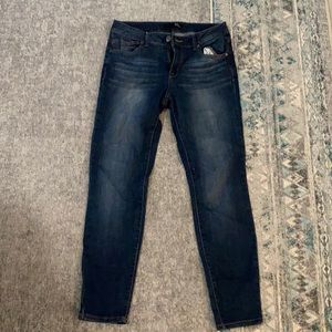 Dark wash denim jeans.